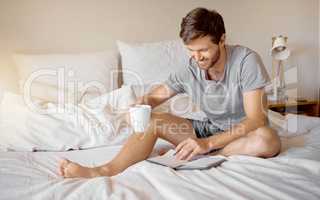 Writing, bed reading and happy man with coffee with his gratitude dairy or motivation journal. Guy with a smile relax at his house bedroom in peace with a positive mindset to start the day at home