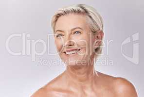 Mature beauty and skin of woman posing in skincare and cosmetics with teeth and smile. Portrait of a happy senior model or elderly lady face in wellness with healthy skin care in a studio.