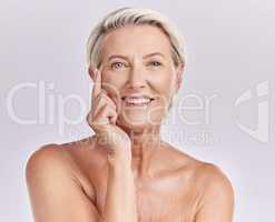 Senior woman applying beauty sunscreen, face cream or moisturizing lotion on skin isolated on studio background. Portrait skincare, health and wellness lady with wrinkles and anti aging moisturizer