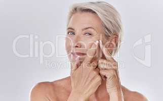 Acne or pimple popping female or woman after night face skincare beauty treatment for healthy and clear skin copy space. Portrait of happy senior woman use cosmetics with hands to target wrinkles