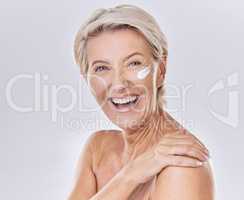 Happy, laughing and sunscreen on skin care beauty model on studio background. Portrait of mature woman, face and smile with healthy skincare, wellness and safety grooming product against sun damage