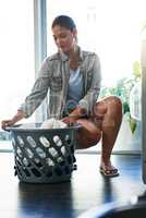 Another day, another chore. a woman doing her daily chores at home.