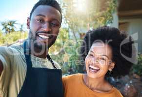 Trendy couple taking selfie outdoors in summer for memories or for sharing on social media. Small business owner or sommelier taking photo with happy customer service influencer or vlogger