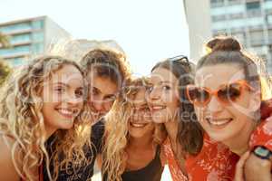 Were just a bunch of young city slickers. Cropped portrait of a group of young friends having a great time out in the city.