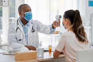 Temperature, covid thermometer and forehead fever check by doctor, medical professional and consulting healthcare worker. Sick or ill female patient with mask in clinic, hospital and health center