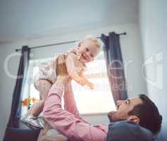 Nothing softens a dads heart like his daughter. a young man spending quality time with his adorable daughter at home.