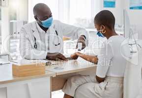 Doctor doing covid wrist temperature test on patient with face mask while consulting in appointment checkup, hospital office or clinic. Woman with healthcare insurance at a covid 19 medical facility