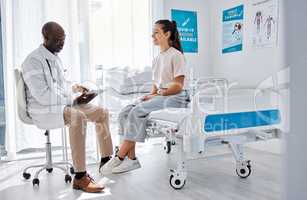 Doctor consulting, explaining diagnosis and medical checkup on digital tablet with patient in a clinic. Healthcare worker and physician in appointment with medicine advice, wellness and test feedback