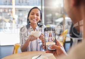 Love, coffee and a cafe, a happy couple meeting for a breakfast date in the city. A man taking a photo of woman on his phone, she has a smile on her face and a cup in her hands, friends and memories.