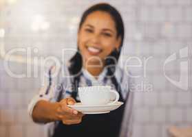 Small business owner, barista manager or waitress in coffee shop, cafe or retail shop with friendly smile and customer service. Restaurant cashier hands cup of coffee, tea or espresso to POV consumer