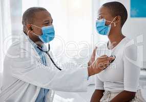 Healthcare, insurance and compliance with covid regulations during a consultation with a doctor and patient. Health care professional doing a checkup with a stethoscope on a young, happy woman