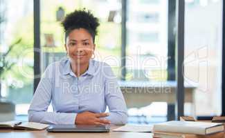 Proud and relaxed business woman or financial advisor consultant with a positive mindset and vision at the office. Portrait of a young accountant smiling ready for work sitting at her desk smiling