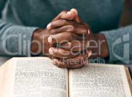 Turn your worries into prayers. an unrecognizable man reading a book.