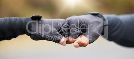 Motivation, teamwork and unity with hands in gloves fist bump to show collaboration, solidarity and working together. Closeup of people showing success, community and achieving a goal as a team