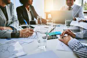 Teamwork is essential to the survival of any business. a group of businesspeople having a meeting in an office.