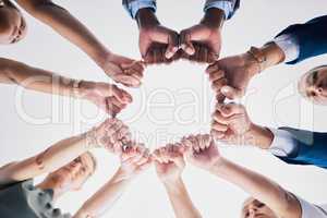 Group of business people, team building hands or fists in a circle in unity. Support, motivation and collaboration in an office partnership. Meeting success in diversity, communication and teamwork.