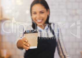 Coffee shop, closeup and barista holding cup and giving it to the customer at cafe. Female restaurant service worker in beverage business. Small business, management and food worker serving client.