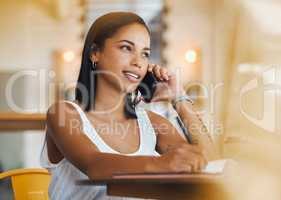 Freelance worker working in a coffee shop talking on a phone call about a growth strategy. Young female student with a positive mindset doing remote work in a cafe and having a mobile conversation