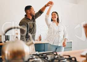 Dance, love and happy couple having fun, romance and bonding while laughing, spinning and twirling together at home. Loving husband enjoying care, smile and dancing while relaxing with playful wife