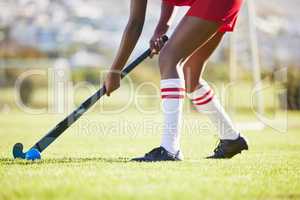Hockey practice or game workout or sports training with a player exercise fitness for a match or sport field event. Strong athlete being active, healthy and fit running outside with ball with a stick