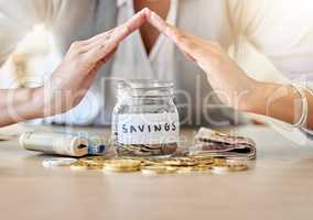 Savings, investment and insurance cover business woman with coins, money and cash in a jar for future plan or personal growth development or housing. Closeup hands covering bank or mortgage expenses