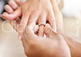 Closeup hand of proposal engagement ring after romantic, caring and loving man proposes to woman. Bonding, happy and in love couple getting engaged with diamond wedding band on valentines day or date