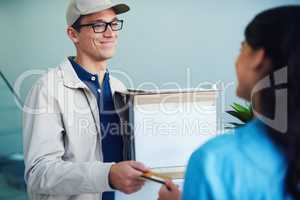 Yet another convenient way to pay. a courier accepting a credit card payment from a customer for a delivery.