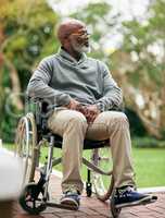 Getting some fresh air. Full length shot of a handsome senior man sitting in his wheelchair outside.