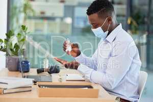 Hygiene, compliance and covid rules at work with a business man sanitize hands before a shift. Professional male worker cleaning hand before going online with marketing project or design