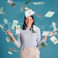 Wealthy, rich and money rain or falling from the sky for financial success and growth. Portrait of a successful, happy and excited female catching cash and enjoying finance investment or lottery win