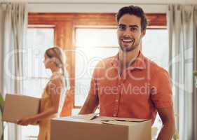 Happy couple moving into new home, people carrying boxes to property and relocating to apartment together. Portrait of smiling, cheerful and handsome man packing for move with woman standing at house