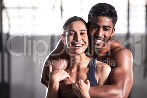Muscular, strong and sensual couple with fit, healthy and sweaty arms from workout training in wellness gym. Hot, perfect and fit boyfriend and girlfriend hugging, embracing after endurance exercise