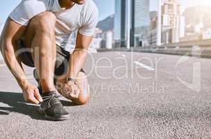 Tie shoes, wellness and fitness male runner ready for run, exercise and workout or cardio training. Healthy, fit and active male jogger preparing for jogging, exercising or physical activity