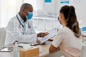 Health insurance, compliance and medical admin in covid pandemic, doctor consulting with patient in office. Healthcare professional helping a woman, discussing plan while signing permission form