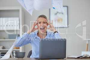Angry, stress and woman screaming at her office desk in frustration and fear at work issues. Serious panic, rage or headache from news about audit, tax or bankruptcy while at corporate job.