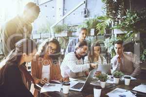 Where productivity flourishes. a group of colleagues having a meeting at a cafe.