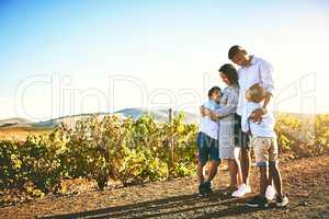 Nurturing their bond with a day out in nature. a happy family bonding together outdoors.