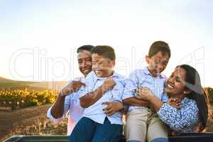 Love and laughter are always in their family. a happy family bonding together outdoors.