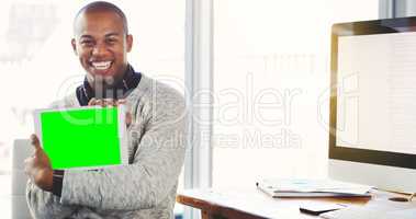 Its the best site to browse for accurate business updates. Portrait of a young businessman holding a digital tablet with a chroma key screen.