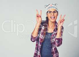 Ive got peace in my soul. an attractive young woman showing the peace sign.
