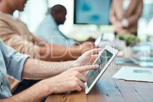 Wireless interactions. an unrecognisable businessman using a digital tablet in an office.