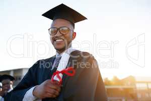 This reward has been years in the making. Portrait of a university student on graduation day.