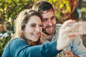 We just love to capture the little moments. a couple taking a selfie.