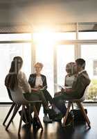 Surround yourself with other like-minded entrepreneurs. a group of corporate businesspeople sitting in a meeting.