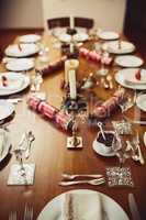 Christmas time is here. High angle shot of a place setting on a table during Christmas.