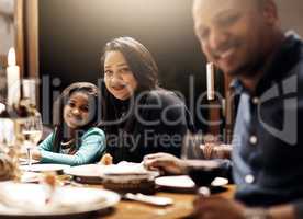 May family be your greatest gift this Christmas. Portrait of a happy family having Christmas lunch together at home.