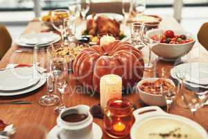 Theres always something to be thankful for. a feast on a dining table with no people at it.