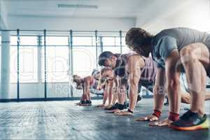 You have to work for whatever you want. an accountability group working out at the gym.