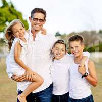 We try to teach our children all about life. a happy family spending time together outdoors.