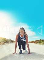 Start with determination and you will end with determination. a sporty young woman getting ready to run outdoors.